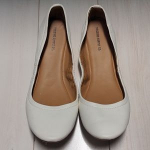 White faux leather flats